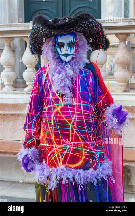 Carnival Goer Dressed In Splendid Costume And Mask During Venice