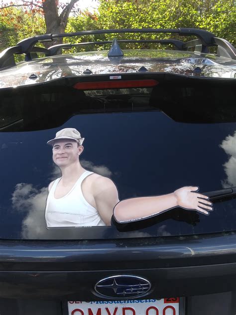 This Forrest Gump Picture On This Rear Windshield That Waves When The