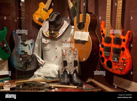 Display Of Guitars And Clothing Related To Alabama A Grammy Award