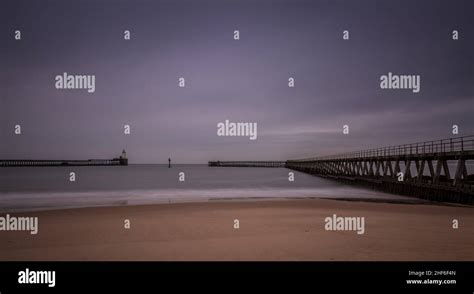 Morning at Blyth beach, with the old wooden Pier stretching out to the North Sea Stock Photo - Alamy