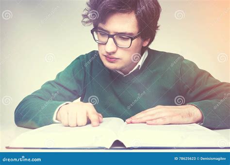 Man In Green Reading Big Book Stock Image Image Of Desktop