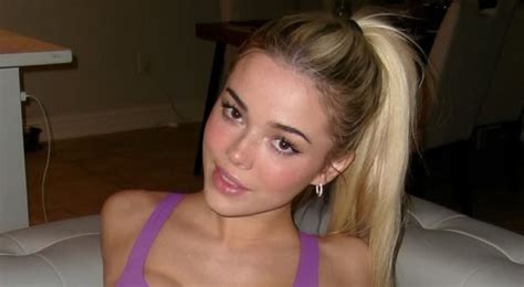 Olivia Dunne Stuns In Red Hot Bikini While Starfishing On Beach