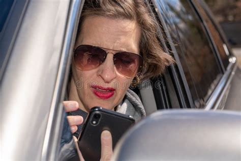 Older Woman Using Her Phone In Her Car Stock Image Image Of Female Attractive 273983617