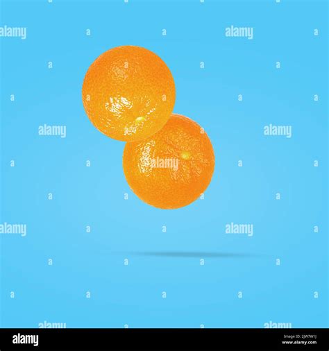 Tangerine Fruit On Creative Colored Background With Clipping Path As