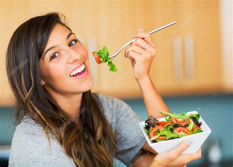 Healthy Woman Eating Salad Stock Photo EpicStockMedia 30935897