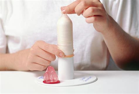 Demonstration Of The Correct Use Of A Condom Photograph By Science