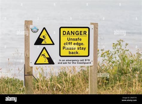 Danger Warning Sign For Unsafe Cliff Edge Swanage Dorset Uk Stock