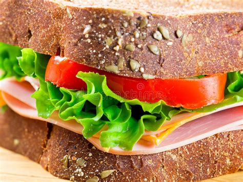 Delicious Stuffed Layer Of Ham And Veggies In Brown Bread Sandwich