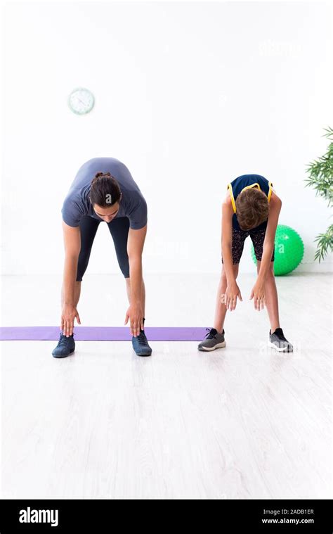 Young father and his son doing exercises Stock Photo - Alamy