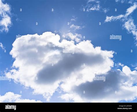 dh White clouds SKY UK Backlit cloud blue sky white grey clouds puffy ...