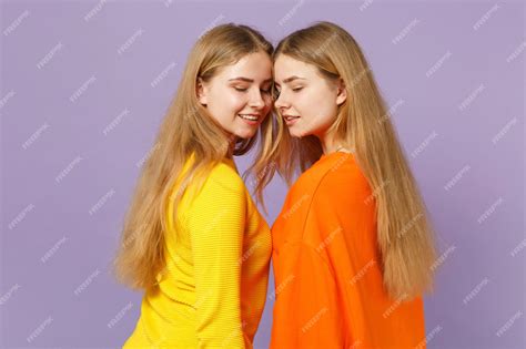 Premium Photo Side View Of Two Pretty Blonde Twins Sisters Girls In