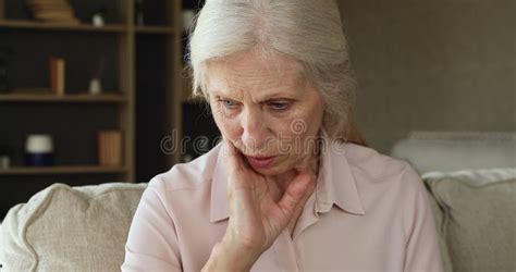 Sad Yearning Mature Woman Sit On Sofa Deep In Thoughts Stock Video