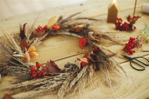 Premium Photo Stylish Autumn Wreath On Rustic Table Wreath With Dried