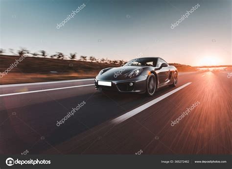 Navy Blue Sport Car Speed Drive On The Autobahn In The Sunset — Stock