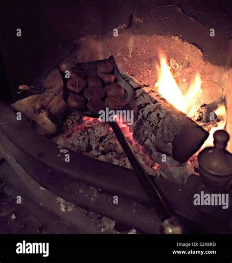 Chestnuts Roasting On An Open Fire Stock Photo Alamy