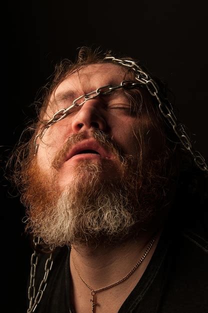 Premium Photo Portrait Of Man Wearing Mask Against Black Background