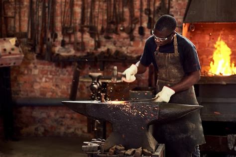 Premium Photo Blacksmith Worker And Metal Forge In Workshop And Manual Industry Working On Hot