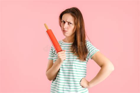 The Angry Brunette Pursed Her Lips In Displeasure And Threateningly
