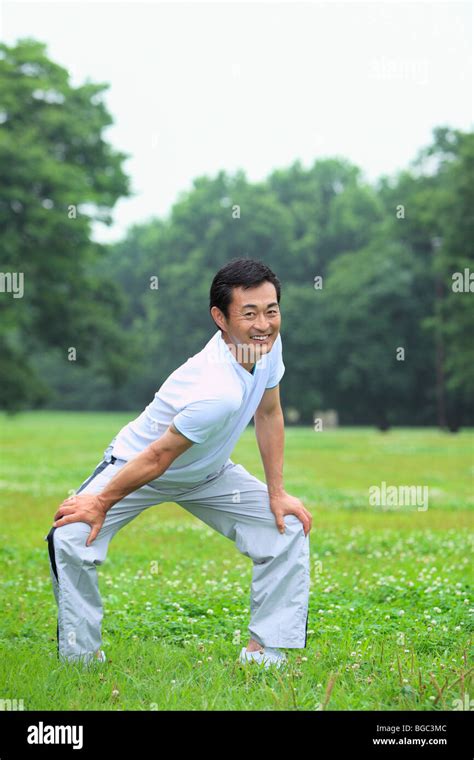 Mature Man Stretching Stock Photo Alamy