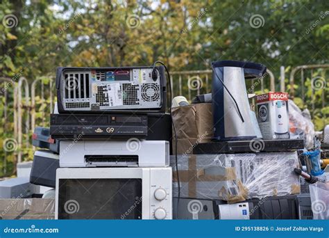 Electronic Waste Awaiting Recycling A Pile Of Garbage In Nature Green