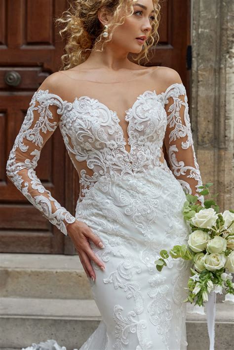 Chic Long Sleeve Lace Fit And Flare Bridal Gown With Open Back Detail