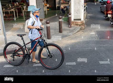 Bangkok Thailand Feb 04 2023 A Man Pushes A Bicycle In Downtown