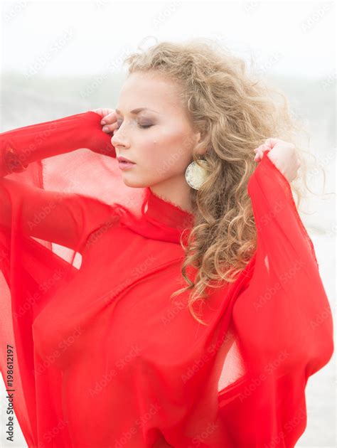 Beautiful Nude Woman In Red Fabric Posing On Sea Beach Stock Photo Adobe Stock