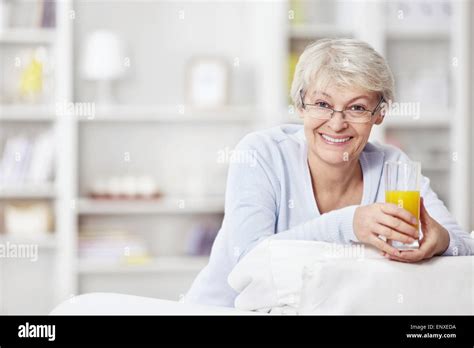 Mature Attractive Woman With A Glass Of Juice Stock Photo Alamy