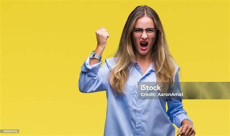 Young Beautiful Blonde Business Woman Wearing Glasses Over Isolated