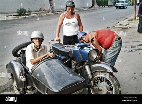 Havana Cuba An Old Woman Sitting In The Sidecar Of A Motorcycle And