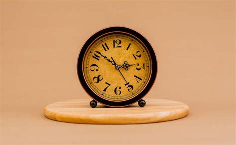 Premium Photo | Brown vintage alarm clock photo of a stationary clock ...