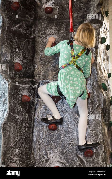 Young Girl Child Kid Childrens Activity On The Climbing Wall At