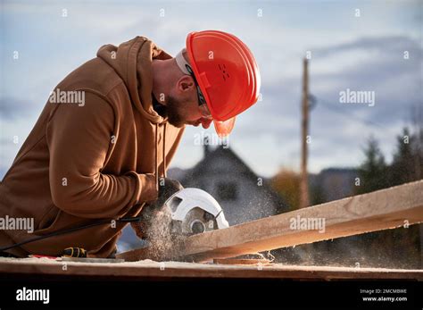 Carpenter Using Circular Saw For Cutting Wooden Plank Man Worker