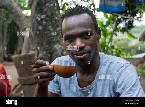 Ethiopian Man Drinking Coffee From Homemade Pumpkin Cup Hi Res Stock