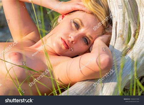Gorgeous Nude Blonde Model Enjoys Summers Stock Photo