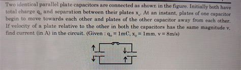 Two Identical Parallel Plate Capacitors Are Connecte Physics