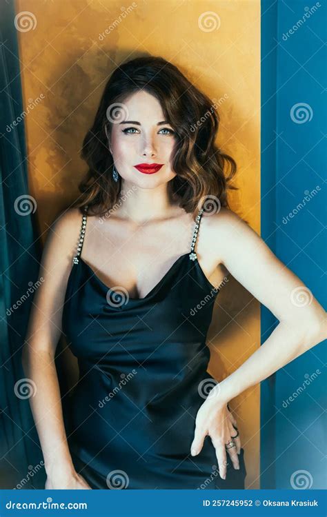 Portrait Of Posh Tempting Woman With Dark Hair In Elegant Cocktail