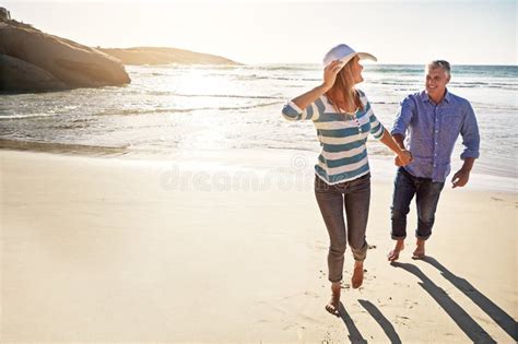 Were Happiest When Were Together A Mature Couple Spending The Day At The Beach Stock Image