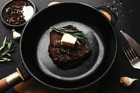 Premium Photo Cooked Ribeye Steak On Cast Iron Pan Pepper Rosemary