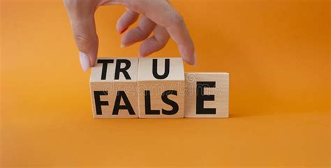 True Vs False Symbol Businessman Hand Turns Cubes And Changes Word