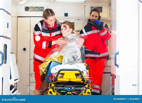 Ambulance Helping Injured Woman Stock Image Image Of Paramedic