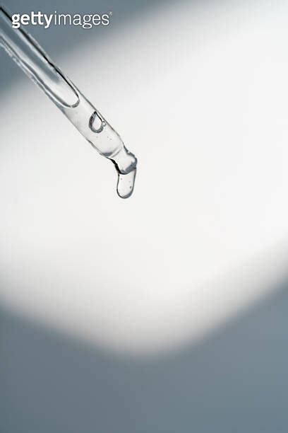 A Drop Of Cosmetic Oil Falls From The Pipette