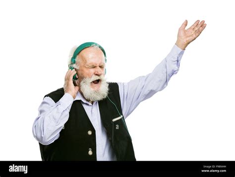 Old Active Bearded Man With Headphones Listening To Music Isolated On