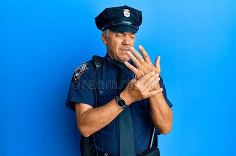 Handsome Middle Age Mature Man Wearing Police Uniform Suffering Pain On