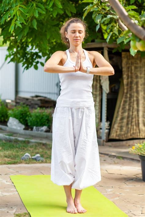 Young Woman Practices Yoga in the Summer Garden - Namaskar Mudra. Surya ...