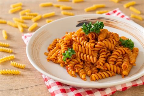 Premium Photo Spiral Or Spirali Pasta With Tomato Sauce And Parsley