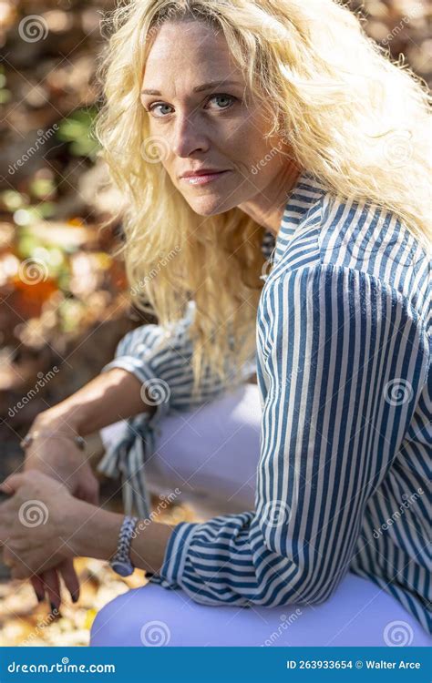 Lovely Blonde Mature Model Posing Outdoors In An Rural Environment
