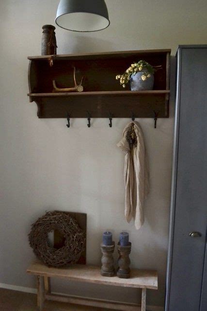 A Room With A Shelf Lamp And Vase On The Wall