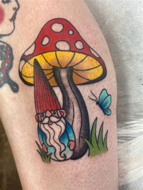 A Mushroom Tattoo On The Right Thigh With A Gnome And Butterfly In