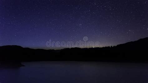 Stars Moving In Night Sky Over Mountain City Stock Footage Video Of